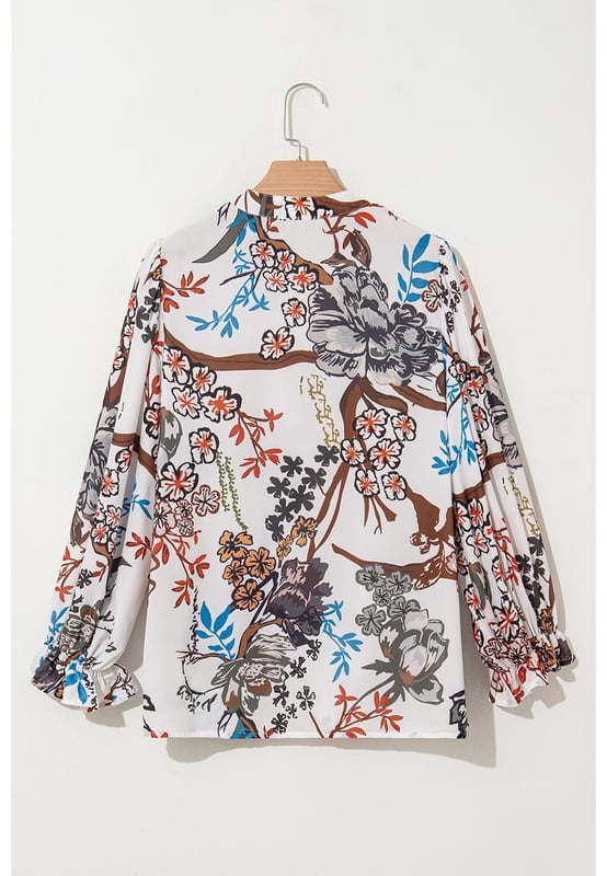 Camisa suelta y casual que permite un fácil movimiento. Impresión floral blanca para un look fresco y relajado todos los días. Botones en la parte delantera para opciones de estilo versátiles. Mangas tipo globo a la moda. Diseño unisex. Material: 100% Poliéster.