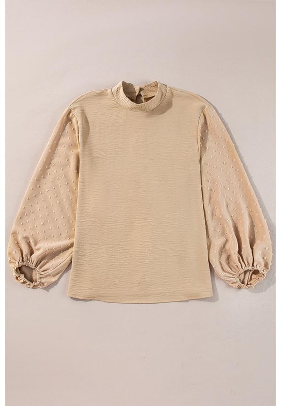 Blusa naranja  
Mangas globo elegantes con puños elásticos  
Detalle de ojo de cerradura en la parte posterior con un delicado cierre de botón dorado  
Patrón de lunares suizos en la tela contrastante en las mangas  
Ligera y cómoda  
Material: 100% Poliéster