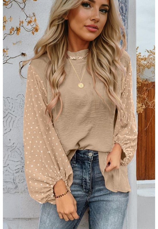 Blusa naranja  
Mangas globo elegantes con puños elásticos  
Detalle de ojo de cerradura en la parte posterior con un delicado cierre de botón dorado  
Patrón de lunares suizos en la tela contrastante en las mangas  
Ligera y cómoda  
Material: 100% Poliéster