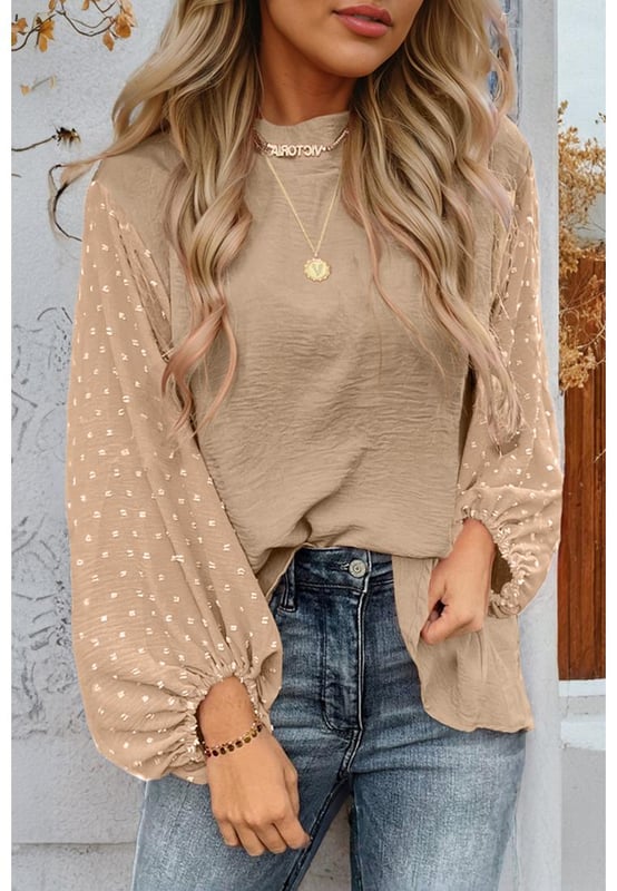 Blusa naranja  
Mangas globo elegantes con puños elásticos  
Detalle de ojo de cerradura en la parte posterior con un delicado cierre de botón dorado  
Patrón de lunares suizos en la tela contrastante en las mangas  
Ligera y cómoda  
Material: 100% Poliéster