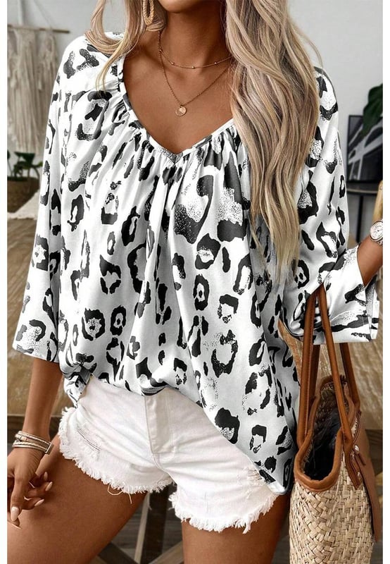 Black Leopard Print Ruched V Neck 3/4 Sleeve Blouse
  Fierce and trendy look
  Flattering V
  neckline adds a touch of sophistication
  Ruched detailing provides a stylish and textured finish
  3/4 sleeves for a versatile and chic appearance
  Suitable for both men and women
  Size chart available for a perfect fit
Material: 100% Polyester