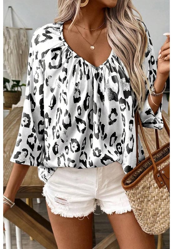 Black Leopard Print Ruched V Neck 3/4 Sleeve Blouse
  Fierce and trendy look
  Flattering V
  neckline adds a touch of sophistication
  Ruched detailing provides a stylish and textured finish
  3/4 sleeves for a versatile and chic appearance
  Suitable for both men and women
  Size chart available for a perfect fit
Material: 100% Polyester