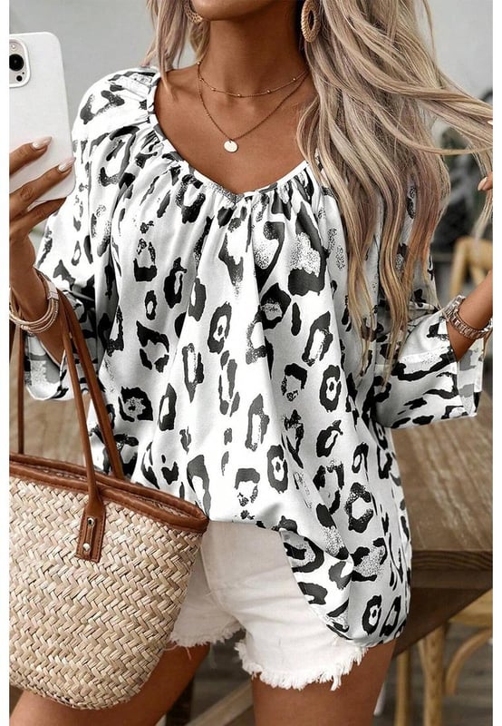 Black Leopard Print Ruched V Neck 3/4 Sleeve Blouse
  Fierce and trendy look
  Flattering V
  neckline adds a touch of sophistication
  Ruched detailing provides a stylish and textured finish
  3/4 sleeves for a versatile and chic appearance
  Suitable for both men and women
  Size chart available for a perfect fit
Material: 100% Polyester