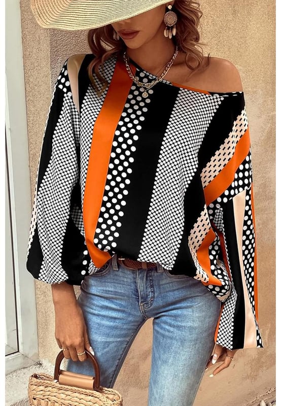 Orange polka dot vertical striped printed blouse
  Loose fit for added comfort
  Playful polka dots for a fun and timeless pattern
  Elegant vertical stripes for a flattering silhouette
  Stylish puff sleeves for a touch of sophistication
  Available in sizes S to XL
Material: 100% Polyester