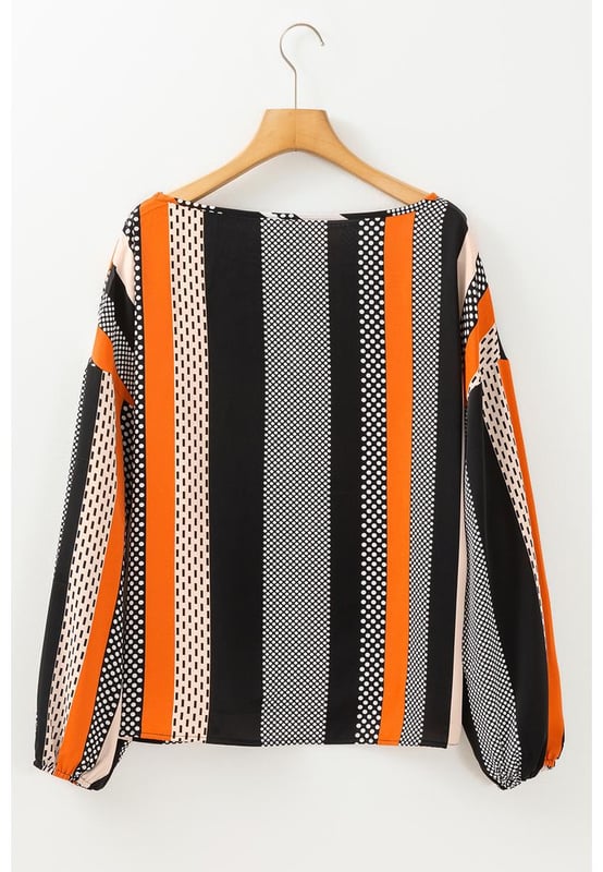 Orange polka dot vertical striped printed blouse
  Loose fit for added comfort
  Playful polka dots for a fun and timeless pattern
  Elegant vertical stripes for a flattering silhouette
  Stylish puff sleeves for a touch of sophistication
  Available in sizes S to XL
Material: 100% Polyester