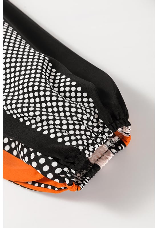 Orange polka dot vertical striped printed blouse
  Loose fit for added comfort
  Playful polka dots for a fun and timeless pattern
  Elegant vertical stripes for a flattering silhouette
  Stylish puff sleeves for a touch of sophistication
  Available in sizes S to XL
Material: 100% Polyester