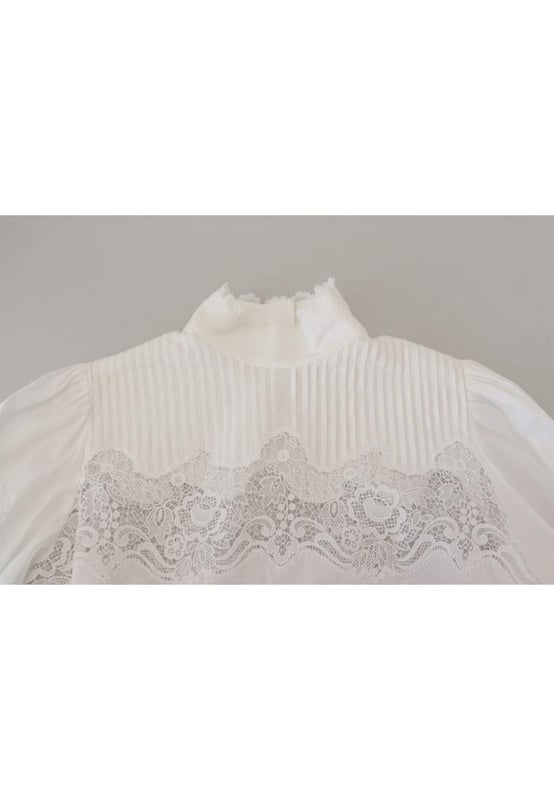 Blusa de algodon 100% autentico de Dolce & Gabbana.
  Top de manga larga.
  Material: 85% algodon 10% nailon 5% poliester.
  Color: Blanco.
  Detalles del logotipo.
  Fabricado en Italia.