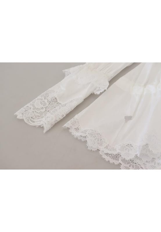 Blusa de algodon 100% autentico de Dolce & Gabbana.
  Top de manga larga.
  Material: 85% algodon 10% nailon 5% poliester.
  Color: Blanco.
  Detalles del logotipo.
  Fabricado en Italia.