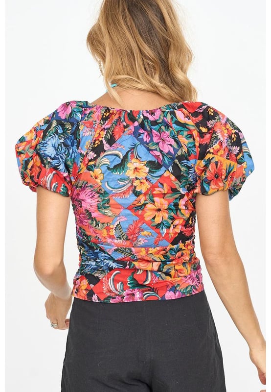 Orange floral print
  Ruched detailing adds texture
  Puff sleeves are on
  trend
  V
  neck design accentuates the neckline
  Captivating floral print for an eye
  catching look
  Available in sizes S M L and XL
Material: 95% Polyester 5% Elastane