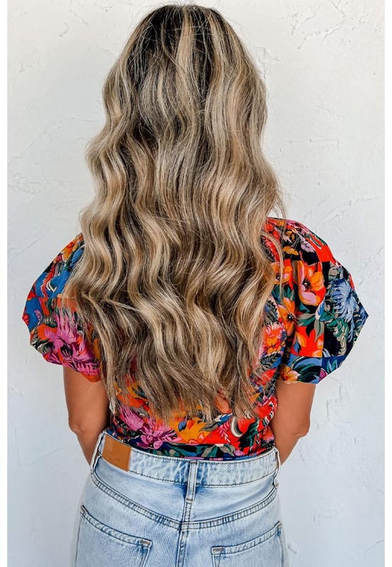 Orange floral print
  Ruched detailing adds texture
  Puff sleeves are on
  trend
  V
  neck design accentuates the neckline
  Captivating floral print for an eye
  catching look
  Available in sizes S M L and XL
Material: 95% Polyester 5% Elastane
