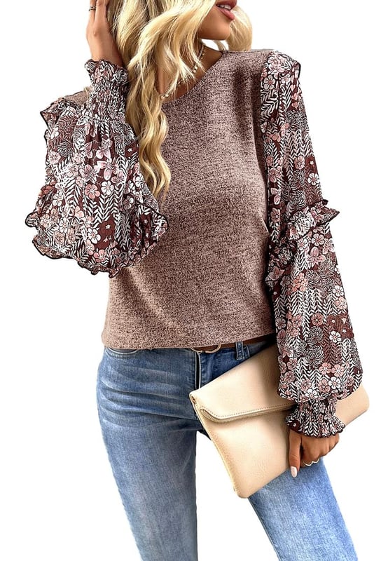 Floral blouse with a charming and eclectic style
  Ruffle detailing along the sleeves for a playful and romantic vibe
  Perfect blend of modern trends and feminine accents
  Puff sleeves add a touch of elegance and femininity
Material: 65% Polyester 30% Viscose 5% Elastane