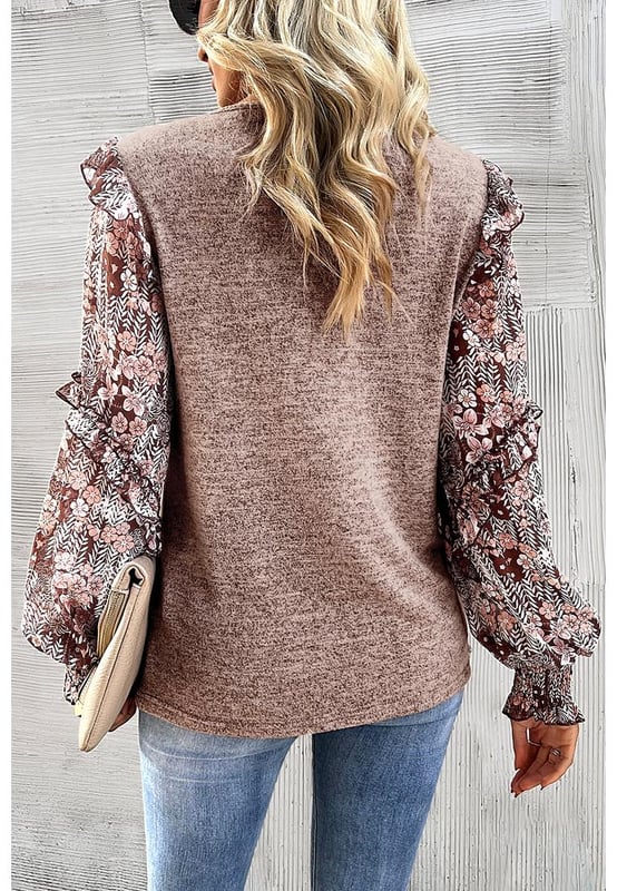 Floral blouse with a charming and eclectic style
  Ruffle detailing along the sleeves for a playful and romantic vibe
  Perfect blend of modern trends and feminine accents
  Puff sleeves add a touch of elegance and femininity
Material: 65% Polyester 30% Viscose 5% Elastane