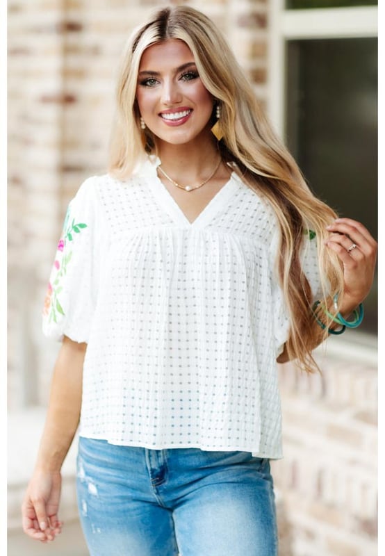 White floral embroidered blouse with puff sleeves
  Lattice design and notched neck
  Relaxed fit for comfortable wear
  Colorful floral embroidery on sleeves
  Suitable for most casual occasions
  Available in different sizes
Material: 100% Polyester