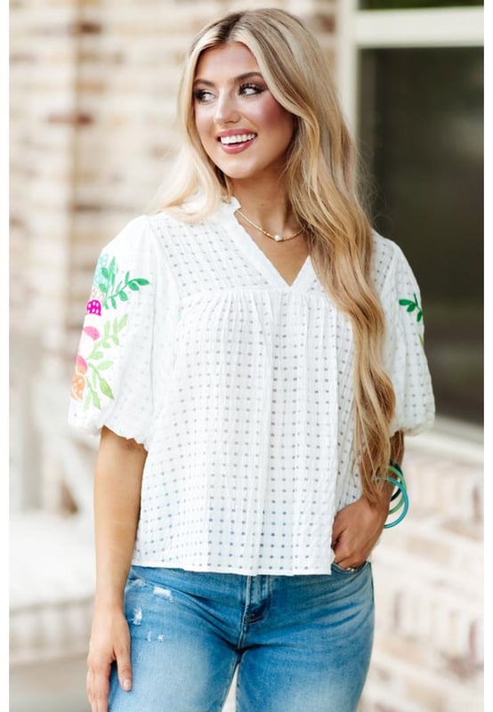 White floral embroidered blouse with puff sleeves
  Lattice design and notched neck
  Relaxed fit for comfortable wear
  Colorful floral embroidery on sleeves
  Suitable for most casual occasions
  Available in different sizes
Material: 100% Polyester