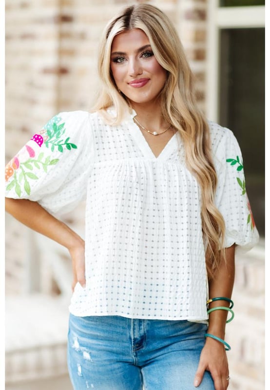 White floral embroidered blouse with puff sleeves
  Lattice design and notched neck
  Relaxed fit for comfortable wear
  Colorful floral embroidery on sleeves
  Suitable for most casual occasions
  Available in different sizes
Material: 100% Polyester
