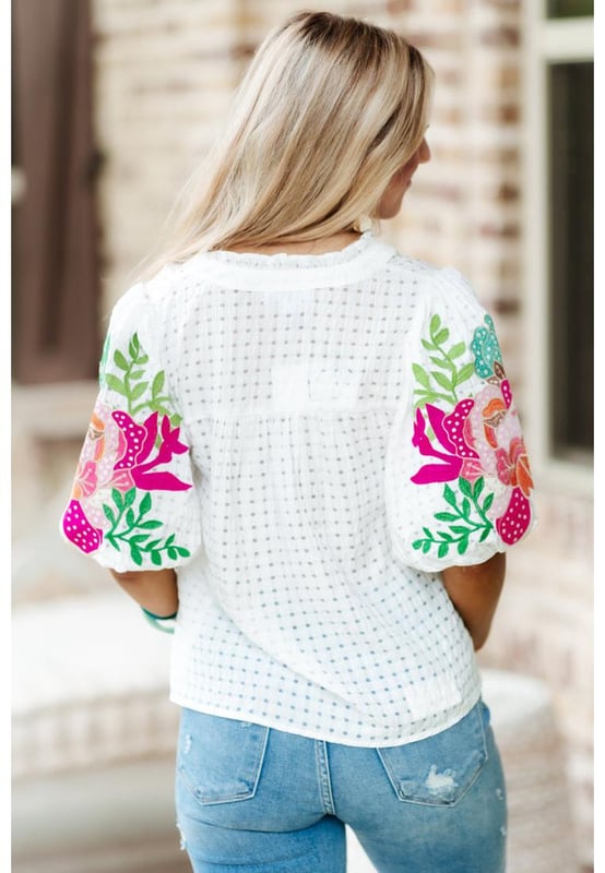 White floral embroidered blouse with puff sleeves
  Lattice design and notched neck
  Relaxed fit for comfortable wear
  Colorful floral embroidery on sleeves
  Suitable for most casual occasions
  Available in different sizes
Material: 100% Polyester