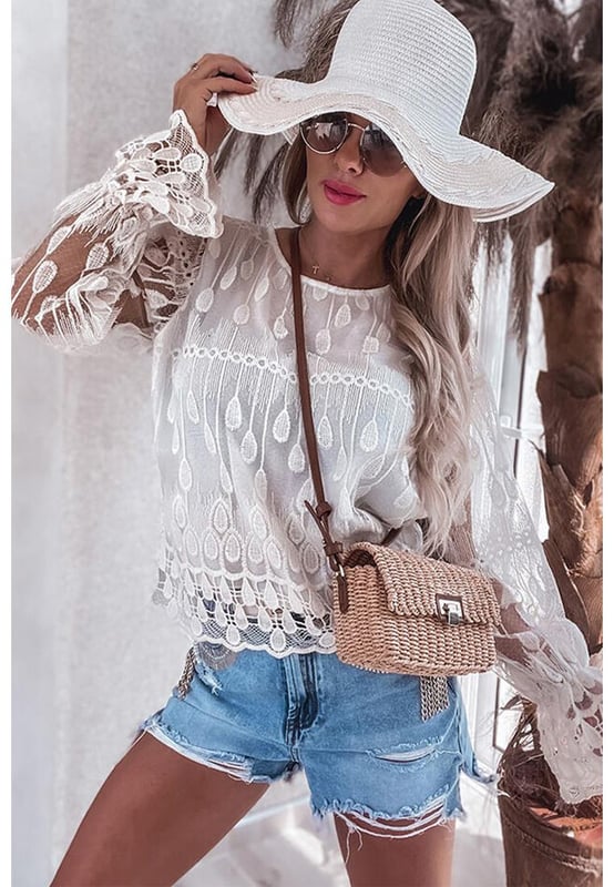 Classic crew neck design
  Delicate embroidered details
  Flounce sleeves for a feminine touch
  Soft and graceful silhouette
  Available in multiple sizes
Material: 100% Polyester