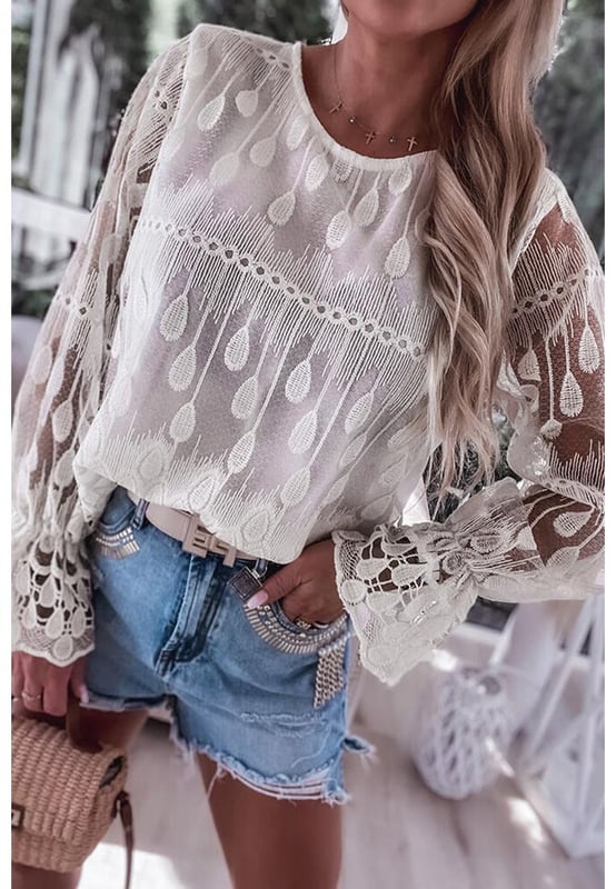 Classic crew neck design
  Delicate embroidered details
  Flounce sleeves for a feminine touch
  Soft and graceful silhouette
  Available in multiple sizes
Material: 100% Polyester