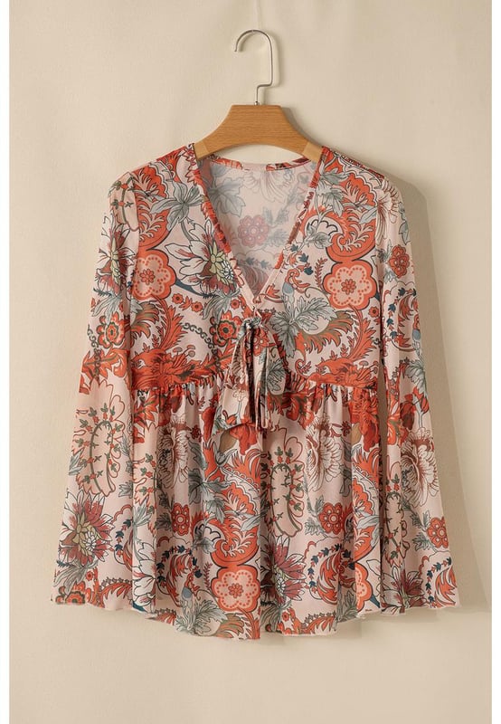 Orange floral print design
  Deep V neck for an elegant neckline
  Front knot detail adds style
  Trendy bell sleeves for a romantic touch
  High elasticity for comfort
  Available in sizes S to XL
Material: 95% Polyester 5% Elastane