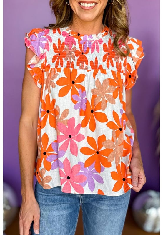 Orange Ruffled Sleeve Smocked Floral Top
  Lightweight and perfect for summer
  Frilled collar smocked chest and keyhole with button back
  Ruffled sleeves
  Available in sizes S M L and XL
Material: 100% Polyester