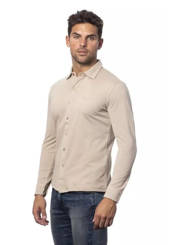 Beige Cotton Shirt
  Regular fit
  Made from Quality cotton
  Comfortable and breathable
  Classic design
  Versatile neutral beige color
  Can be dressed up or down
  Timeless addition to any stylish mans collection
Material: 100% Cotton