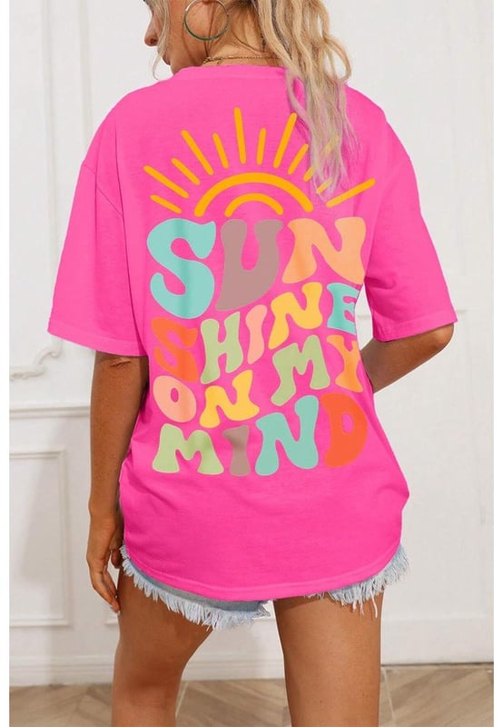 Bright Pink SUNSHINE ON MY MIND Graphic Tee
  Baggy T
  shirt with dropped shoulders and loose cut
  Colorful SUNSHINE ON MY MIND pattern on the back
  Versatile style pairs effortlessly with jeans shorts or a skirt
  Available in all stylish styles
  Size chart available to choose the right size
  Designed for both men and women
Material: 95% Cotton 5% Polyester