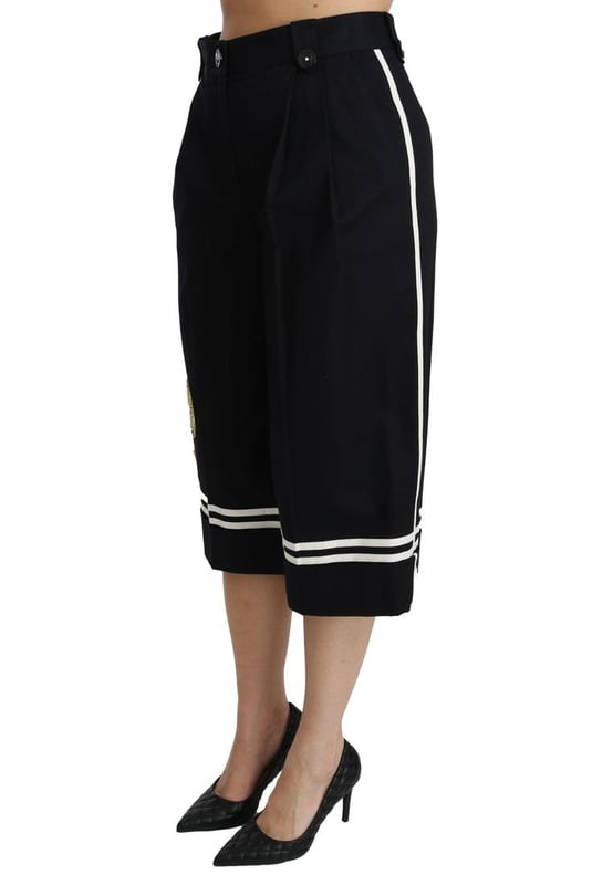 Merk: Dolce & Gabbana  
Staat: Nieuw met etiketten  
Stijl: Hoge taille palazzo cropped broek  
Pasvorm: Reguliere pasvorm  
Materiaal: 90% Katoen 1% Elastaan  
Kleur: Zwart met citroenversieringen  
Vlies: Ritssluiting en knoopsluiting  
Logo-details  
Gemaakt in Italië