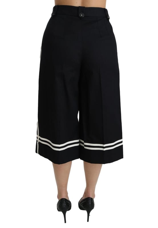 Merk: Dolce & Gabbana  
Staat: Nieuw met etiketten  
Stijl: Hoge taille palazzo cropped broek  
Pasvorm: Reguliere pasvorm  
Materiaal: 90% Katoen 1% Elastaan  
Kleur: Zwart met citroenversieringen  
Vlies: Ritssluiting en knoopsluiting  
Logo-details  
Gemaakt in Italië