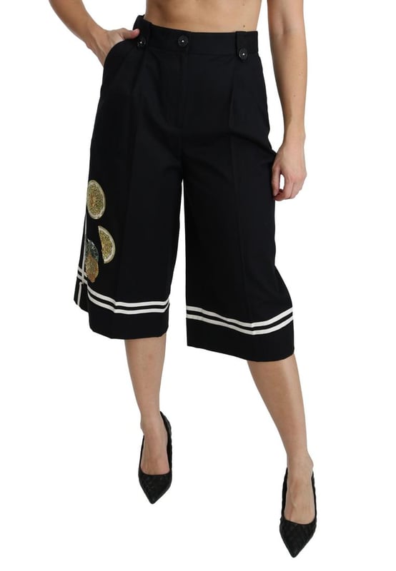 Merk: Dolce & Gabbana  
Staat: Nieuw met etiketten  
Stijl: Hoge taille palazzo cropped broek  
Pasvorm: Reguliere pasvorm  
Materiaal: 90% Katoen 1% Elastaan  
Kleur: Zwart met citroenversieringen  
Vlies: Ritssluiting en knoopsluiting  
Logo-details  
Gemaakt in Italië