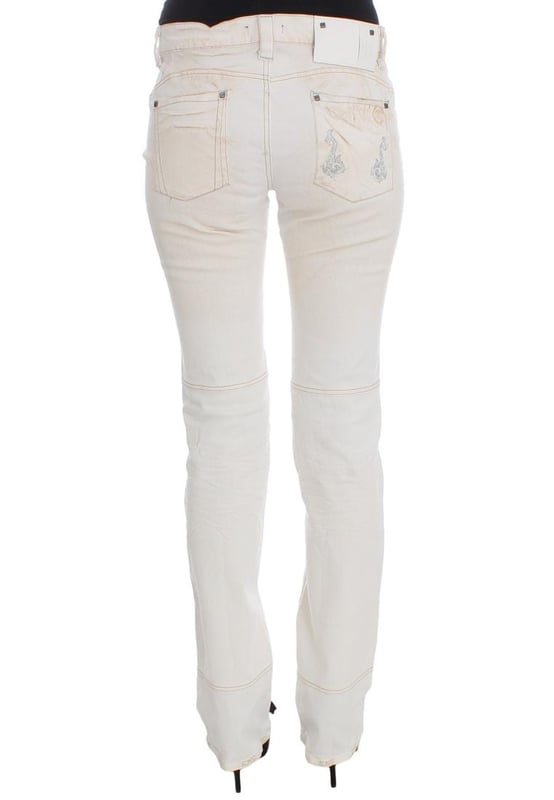 CoSTUME NATIONAL CNC Jeans
  Slim Fit
  Color: White
  Material: 97% Cotton 3% Other Fibers
  Fly: Zipper and button
  Logo details