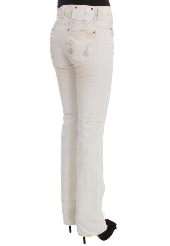 CoSTUME NATIONAL CNC Jeans
  Slim Fit
  Color: White
  Material: 97% Cotton 3% Other Fibers
  Fly: Zipper and button
  Logo details