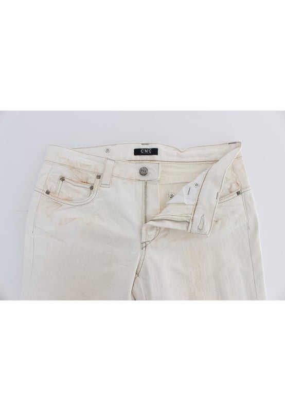 CoSTUME NATIONAL CNC Jeans
  Slim Fit
  Color: White
  Material: 97% Cotton 3% Other Fibers
  Fly: Zipper and button
  Logo details