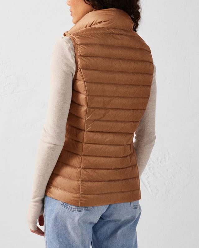 Stay warm with the sleek and stylish Seda Down Gilet. Designed for those who seek comfort and elegance in any casual setting.