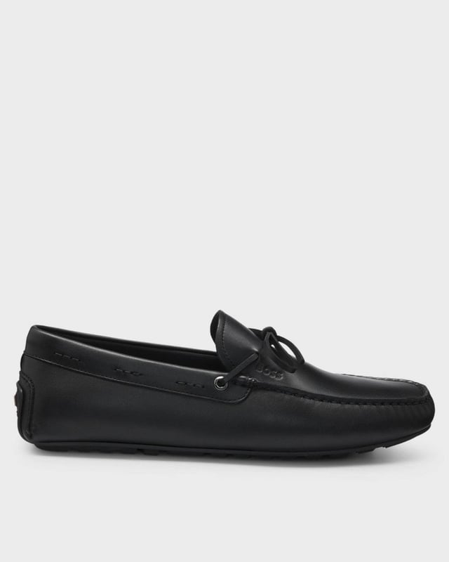 With a pebbled outsole for great traction, these driver-style BOSS Menswear moccasins are a modern must. Soft leather uppers with a bow trim.

Fastening top: Slip-on
Fully lined
Packaging: Box

 Upper material: 100% Cow skin, Lining: 90% Polyamide, 10% Polyurethane, Sole: 100% Thermoplastic polyurethane, Innersole: 90% Polyamide, 10% Polyurethane 
50541771