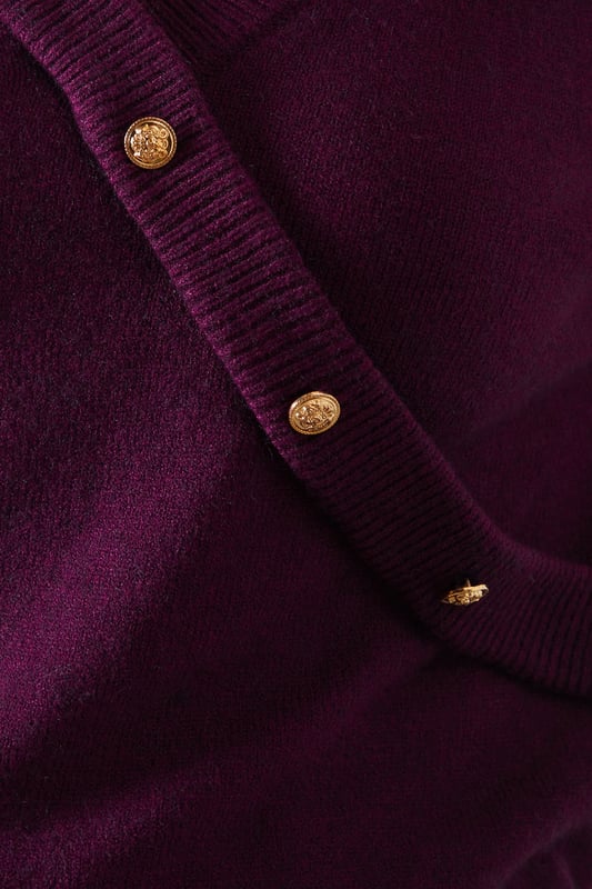Stylish wrap design with button detail
        V-neckline for a flattering silhouette
        Long sleeves for versatile wear
        Slouchy fit offering comfort and style
        Ribbed cuffs and hem for a polished finish
    
    Embrace effortless sophistication with this button detail wrap slouchy jumper from Wallis. The wrap design, accentuated by eye-catching buttons, adds a touch of elegance to your everyday wardrobe. Its relaxed fit ensures comfort without compromising on style, making it perfect for various casual occasions. Pair it with your favourite jeans and ankle boots for a chic daytime look, or layer it over a collared shirt for a smart-casual ensemble. The versatility of this jumper shines through at family gatherings or lunch dates with friends. For a cosy yet put-together appearance, team it with wide-leg trousers and loafers. This Wallis jumper is a testament to the brand's commitment to blending comfort with glamour, ensuring you feel confident and stylish for any casual event.