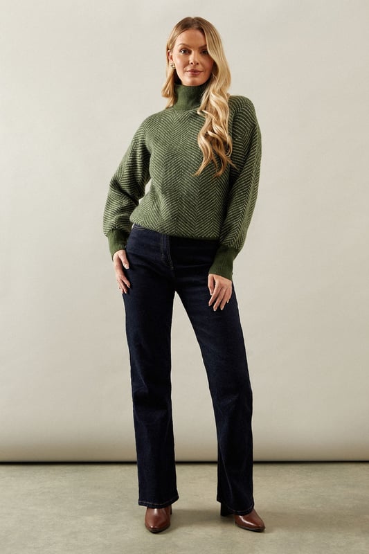 Striking chevron stitch pattern adds visual interest
        Cosy roll neck design for extra warmth
        Relaxed fit with dropped shoulders for comfort
        Ribbed cuffs and hem for a snug finish
        Versatile knit suitable for various occasions
    
    Embrace sophistication and comfort with this exquisite Chevron Stitch Roll Neck Jumper from Wallis. The eye-catching chevron pattern radiates elegance, while the roll neck design offers both style and warmth. Perfect for those chilly autumn days or cosy winter evenings, this jumper effortlessly transitions from day to night. Pair it with dark wash jeans and ankle boots for a casual yet polished look, ideal for family gatherings or weekend brunches. For a more refined ensemble, team it with tailored trousers and heeled loafers, making it suitable for informal work settings or dinner dates. The relaxed fit ensures ease of movement, while the textured knit adds a touch of luxury to your wardrobe. This versatile piece is a must-have for the fashion-conscious woman who values both style and comfort in her everyday attire.