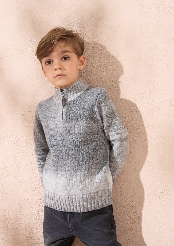 This knit is ready to take on chilly days! Super soft yarn in stylish   ombre with a funnel neck and 1/4 zip opening. Wear with denim or cargos.