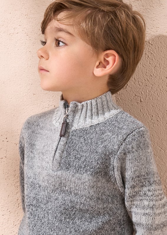 This knit is ready to take on chilly days! Super soft yarn in stylish   ombre with a funnel neck and 1/4 zip opening. Wear with denim or cargos.