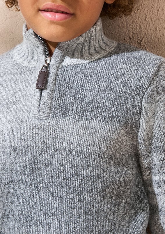 This knit is ready to take on chilly days! Super soft yarn in stylish   ombre with a funnel neck and 1/4 zip opening. Wear with denim or cargos.