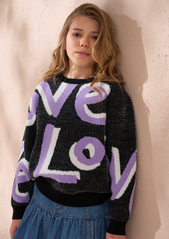 Love is our new fluffy slogan knit! Crafted from the softest monochrome yarn. highlighted with lilac and cut into a relaxed silhouette. Style with anything for wearable optimism!.