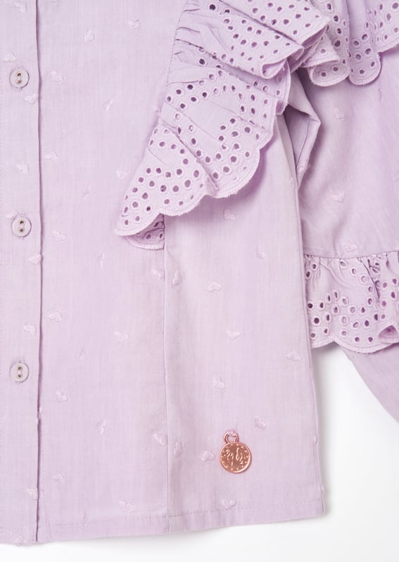 We heart our new blouse with beautiful broderie ruffles on the sleeve and scattered embroidered hearts. Button through with a frill detail collar in the colour of the season. we lilac it a lot!.
