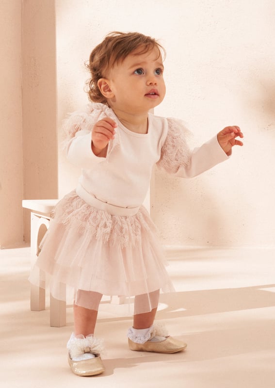 Get ready to capture precious moments with your little one in this charming lace ruffle set. Featuring a super soft jersey body adorned with delicate lace frill and a twirl-tastic tutu. Adorbs.