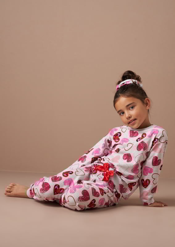 Perfect for your little dreamer. These super cute leopard heart print PJs in classic   marl are made in the softest jersey and come with a matching hair scrunchie. Ideal for gifting. We heart them!.