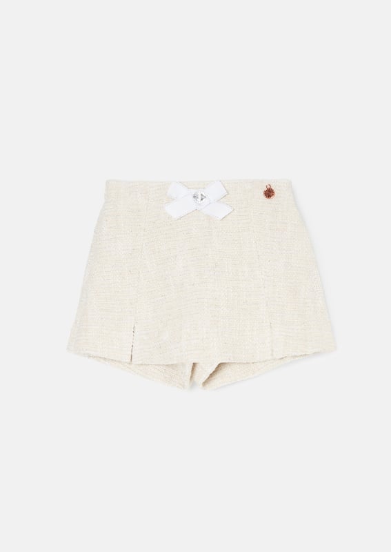 We TWEED to tell you how fabulous this short is. Cut into an elegant skort profile in classic ecru with metallic highlights that catch the light with every twirl. The epitome of chic meets fun. wear with our matching top for the co-ord of dreams.