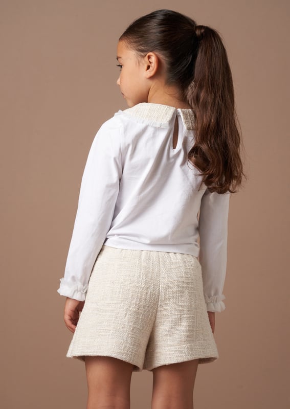We TWEED to tell you how fabulous this short is. Cut into an elegant skort profile in classic ecru with metallic highlights that catch the light with every twirl. The epitome of chic meets fun. wear with our matching top for the co-ord of dreams.