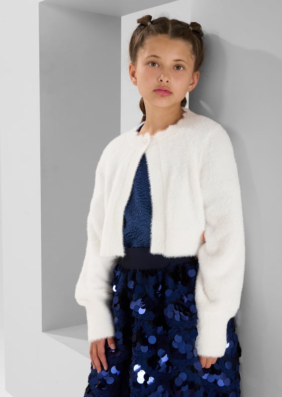 The perfect cover up. A super soft fluffy knit in classic off   finished with the prettiest diamante buttons.Snuggly and stylish in equal measure.. About Me: 100% Nylon. Look After Me: Think Planet. Wash At 30C.