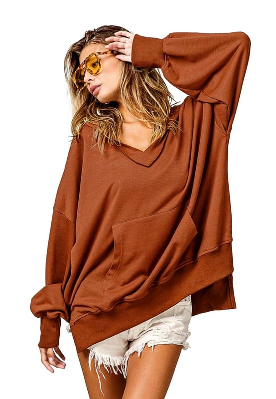 Chestnut V Neck Kangaroo Pocket Oversized Hoodie
  Perfect for lounging at home or running errands in comfort
  V
  neck design adds a modern twist to this classic hoodie
  Kangaroo pocket provides a convenient and practical touch
  Relaxed fit for a versatile and comfortable option for everyday wear
  Made with fine fabric
  Perfect for layering over your favorite tops for a relaxed and casual look
  Available in multiple sizes (check size chart for perfect fit)
Material: 65% Polyester 30% Cotton 5% Elastane