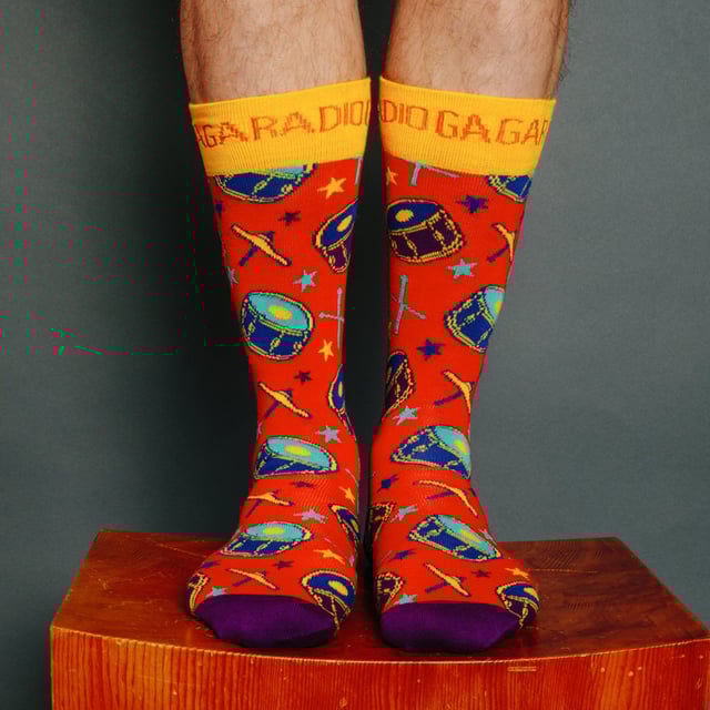 Happy Socks Queen Socks: Happy Socks are a popular brand providing a high-quality sock that combines unique designs and craftsmanship. Mikael Söderlindh and Viktor Tell had a vision to spread happiness by turning an everyday essential into a colorful design piece. In 2008, socks were just socks. White, grey and black pieces of textile that were nowhere close to the fashionable and creative design piece they could become. The world’s most comfortable and colorful tool for spreading happiness was born. This concept is now brought to life by Happy Socks’ talented team of creatives. Today, Happy Socks has reached 90 countries and every continent. With Concept Stores all around the world, from LA to Tokyo, Happy Socks can be found in over 10,000 top fashion apparel boutiques. These socks are made from a soft, high quality combed cotton rich blend and in a fine gauge knit for versatile wear. Finished with a comfortable smooth toe seam, these socks feature standard cuffs, and are officially licensed limited edition socks. They come in a pack of 1 pair. They are machine washable at 40. They are made from 86% Cotton 12% Polyamide 2% Elastane. Extra Product Details: - Queen Socks by Happy Socks - Bohemian Rhapsody - We Will Rock You - Radio Ga Ga Socks - Colour Block Design - Unique and Funky Patterns - 1 Pair Pack - Machine washable at 40 - 86% Cotton 12% Polyamide 2% Elastane.