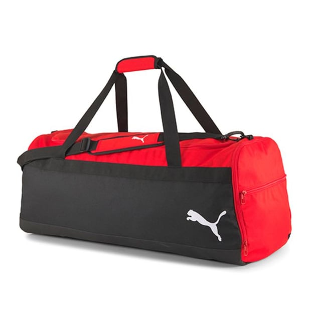 The Puma 81L TeamGoal 23 Black/Red Large Team Bag is the ultimate choice for athletes or teams in need of a spacious, durable, and high-quality bag to transport gear. With an impressive 81-liter capacity, this bag is designed to hold all your essential equipment, from clothing and shoes to balls and accessories. Its rugged construction ensures long-lasting durability, while the bold black and red design offers a sleek, professional look.
Key Features:
Massive 81L Capacity: 

The 81-liter capacity offers ample space for all your team or personal gear, making it ideal for large sports teams, training sessions, or tournaments. Thereâ€™s plenty of room for uniforms, boots, training equipment, and more.


Durable Design: 

Made with high-quality, durable materials, this bag is built to withstand heavy use, making it perfect for frequent travel and handling.


Multiple Pockets: 

The bag includes side compartments and a front pocket, allowing you to organize your smaller items like keys, phones, or accessories for easy access.


Easy to Carry: 

Equipped with adjustable shoulder straps and a padded carry handle, the bag offers multiple carrying options for comfort, whether you're carrying it over your shoulder or by hand.


Ventilated Sections: 

Includes ventilated sections to keep your gear fresh, reducing moisture buildup, especially after intense workouts or matches.


Bold Black/Red Colorway: 

The black and red color combination provides a sleek, sporty look that reflects Puma's signature style, perfect for any team or individual athlete.


Puma Branding: 

Featuring the Puma logo on the front, this bag represents the brand's commitment to quality and performance, trusted by athletes worldwide.


The Puma 81L TeamGoal 23 Black/Red Large Team Bag is a must-have for athletes or teams looking for a reliable, spacious bag that offers ample storage, organization, and durability. Whether you're traveling to a match, heading to training, or simply need a large, high-quality bag for your gear, this bag has you covered.