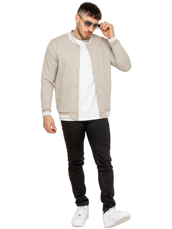 The Enzo Milano Men's Bomber Jacket combines classic style with modern comfort. Designed in a regular fit, it features a stretch fabric for ease of movement and all-day comfort. The contrast-tipped ribbed collar and cuffs add a stylish touch, while the popper fastening ensures easy wear. With two practical pockets and ribbed trims for a snug fit, this versatile jacket is perfect for any casual or smart-casual look.(35)